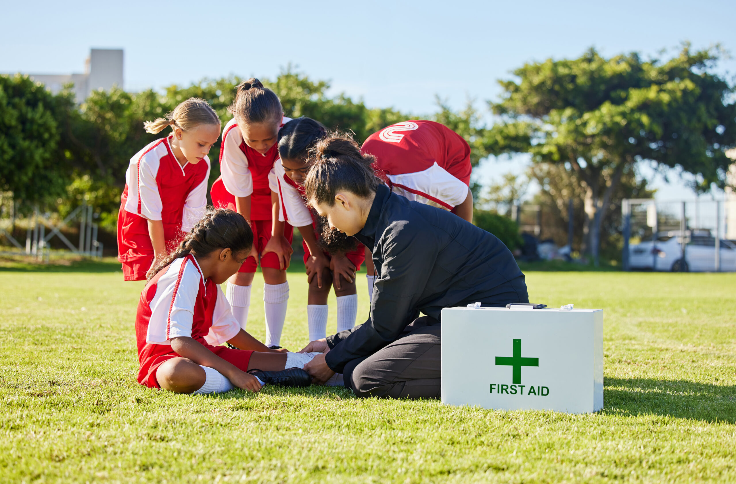 sports first aid and children soccer team