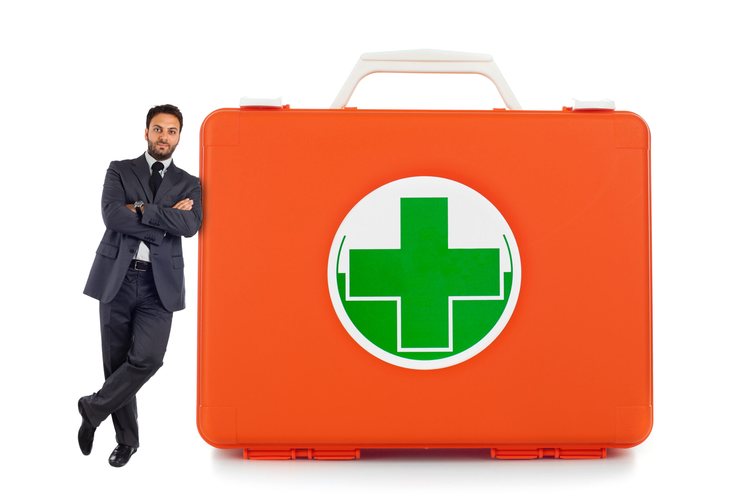 Young business man leaning against near a comprehensive first aid kit