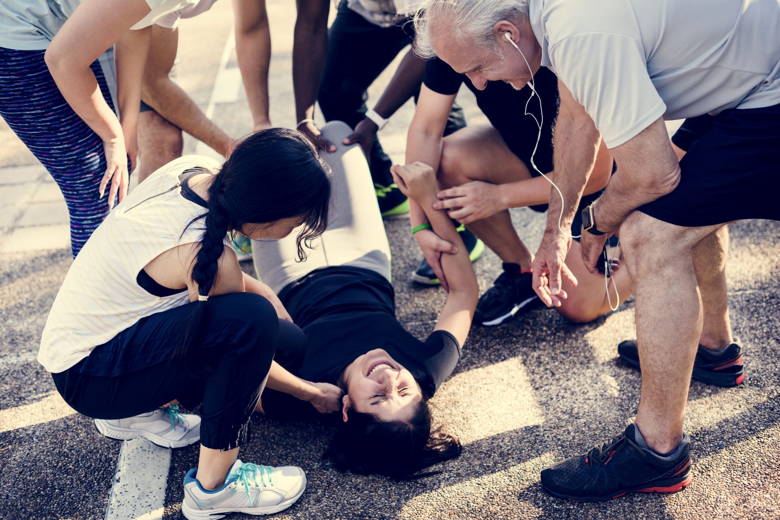 Group of people assisting an injured person
