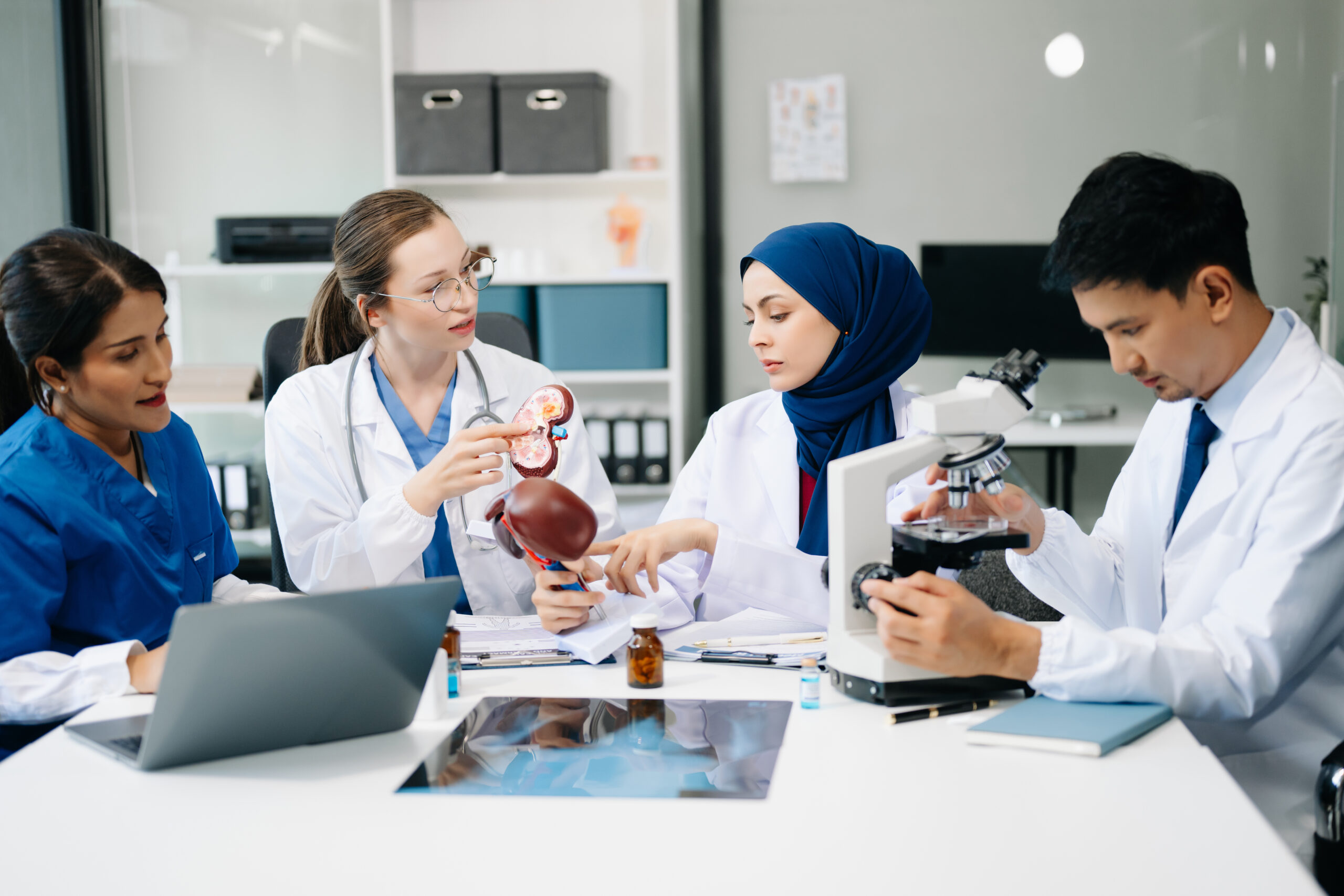 Medical, meeting and doctors with laptop for research, planning