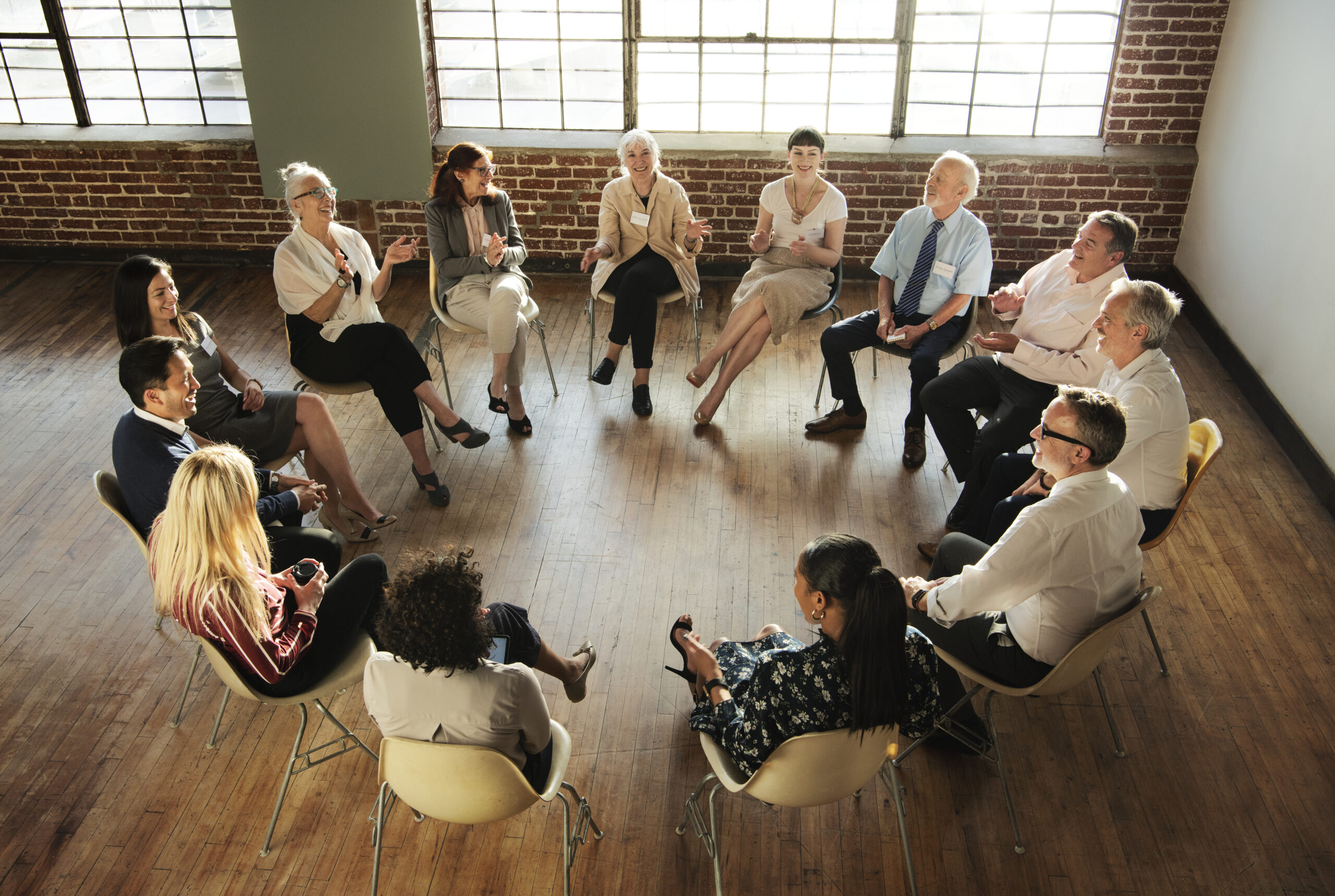 People sitting and talking with a group