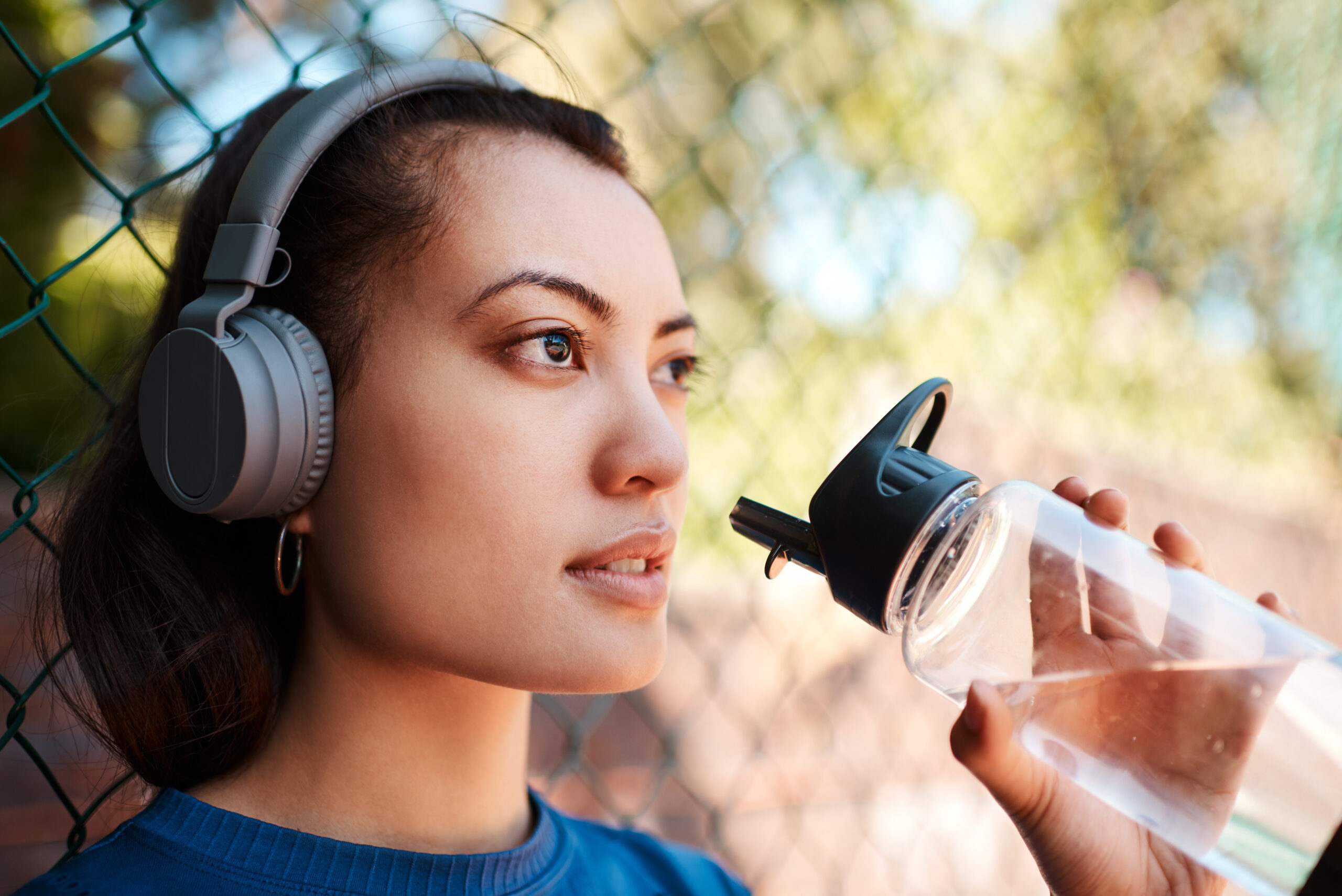 shot of a sporty young woman drinking water while 2023 11 27 05 12 58 utc