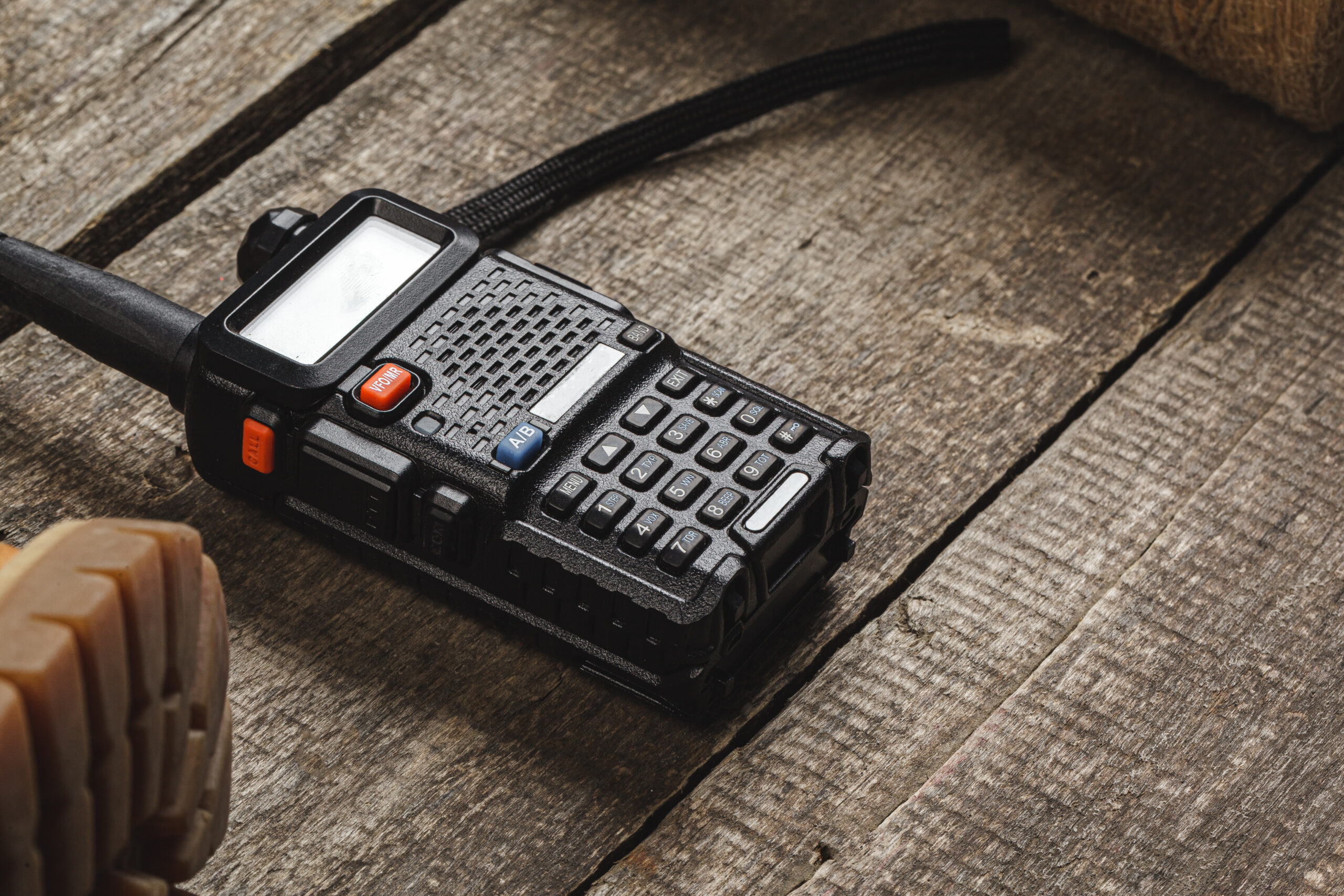 Walkie talkie radio set on wooden table close up