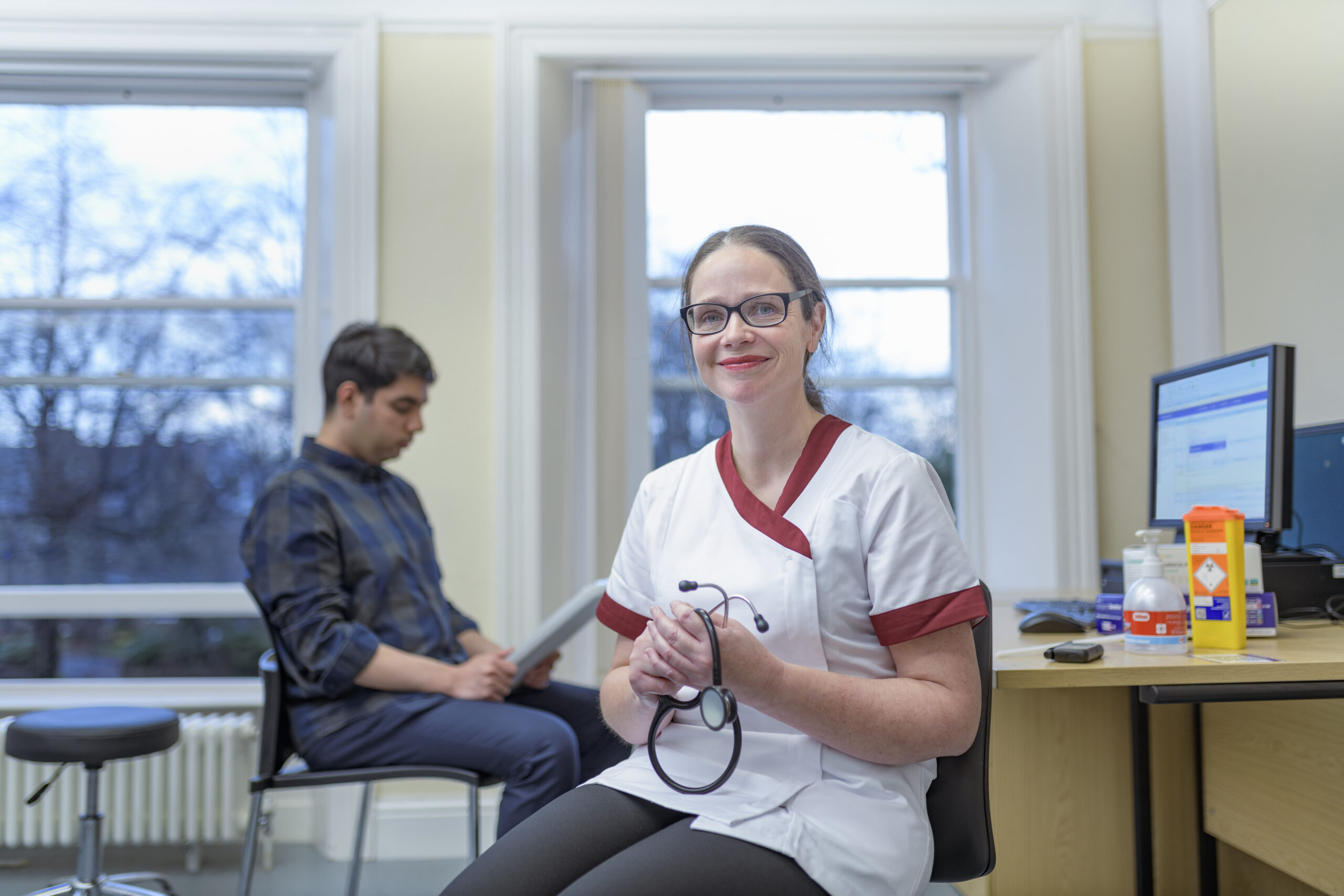 Portrait of smiling nurse in doctors office