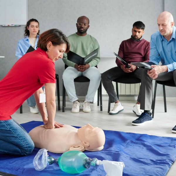 female instructor showing cpr on training doll 2023 11 27 04 59 29 utc scaled.jpg